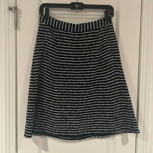 Theory boucle like black/white A-line skirt, just below the knee with pockets!